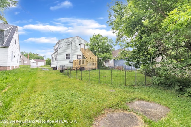 316 S Rosemary Ave, Lansing, MI 48917 - view of yard featuring a deck