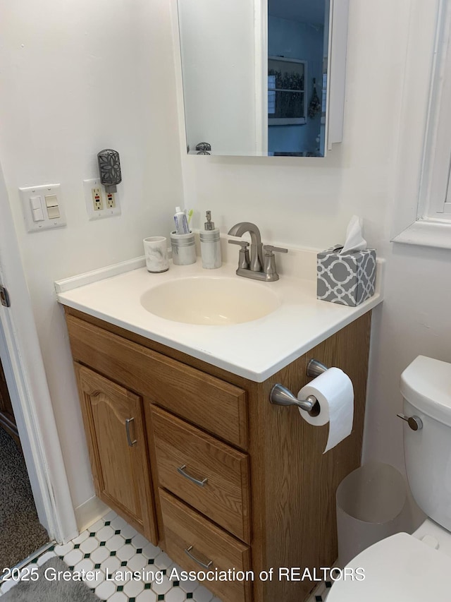 575 Brookland Blvd, Lansing, MI 48910 - bathroom with vanity and toilet
