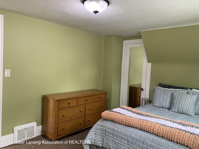575 Brookland Blvd, Lansing, MI 48910 - bedroom with dark carpet