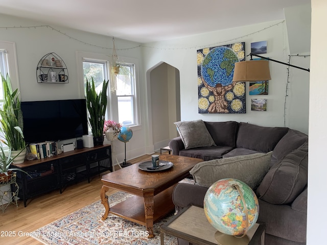575 Brookland Blvd, Lansing, MI 48910 - living area with light wood finished floors and arched walkways