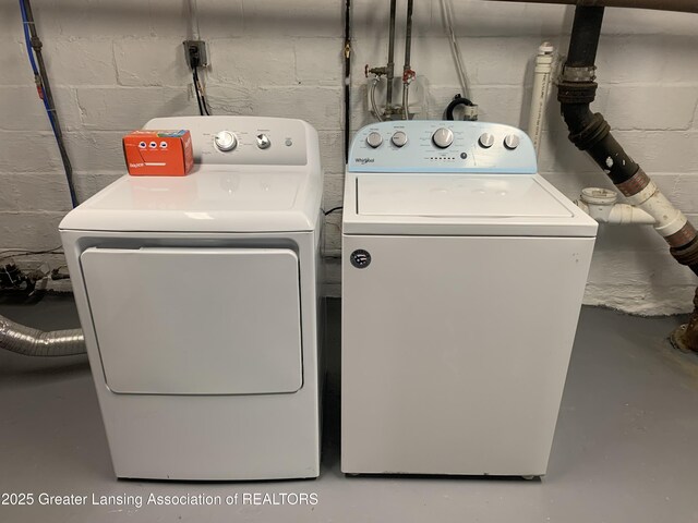 575 Brookland Blvd, Lansing, MI 48910 - washroom featuring washing machine and dryer and concrete block wall