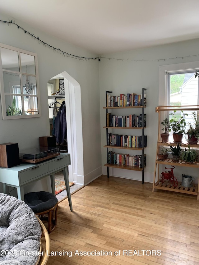 575 Brookland Blvd, Lansing, MI 48910 - home office featuring arched walkways and light wood-style flooring