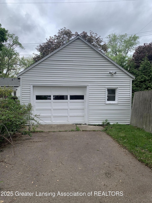 575 Brookland Blvd, Lansing, MI 48910 - garage featuring driveway