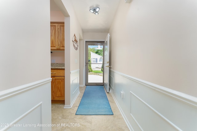 2305 Post Oak Ln, Lansing, MI 48912 - doorway to outside featuring light tile patterned floors