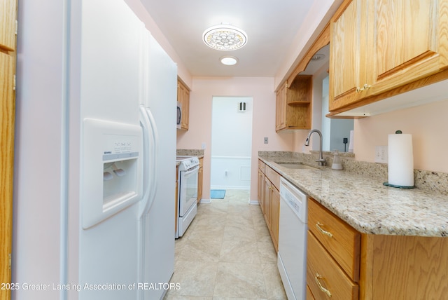 2305 Post Oak Ln, Lansing, MI 48912 - kitchen featuring white appliances, a sink, light stone counters, light tile patterned floors, and open shelves