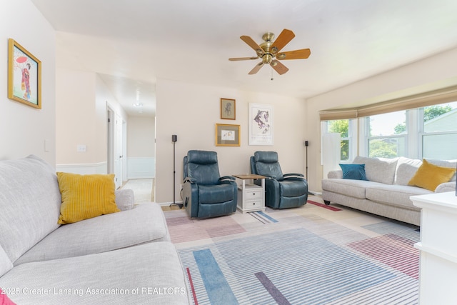 2305 Post Oak Ln, Lansing, MI 48912 - living area featuring a ceiling fan and a wainscoted wall
