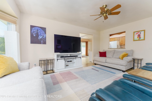 2305 Post Oak Ln, Lansing, MI 48912 - living area featuring healthy amount of natural light, ceiling fan, and light wood-type flooring