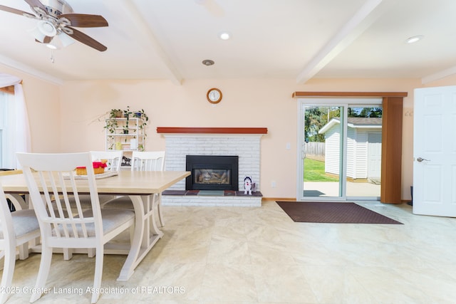 2305 Post Oak Ln, Lansing, MI 48912 - dining space featuring beamed ceiling, ceiling fan, a brick fireplace, and recessed lighting