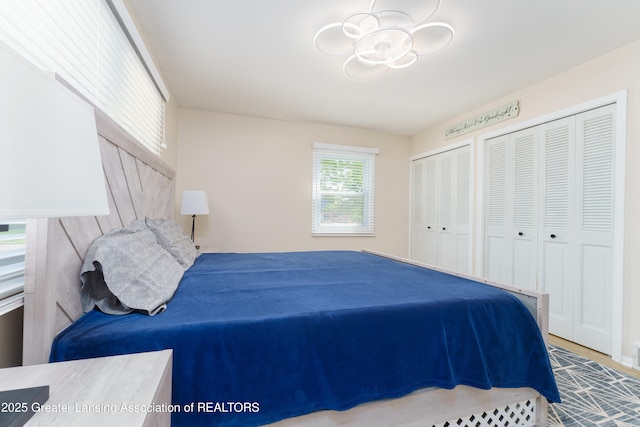 2305 Post Oak Ln, Lansing, MI 48912 - bedroom featuring two closets