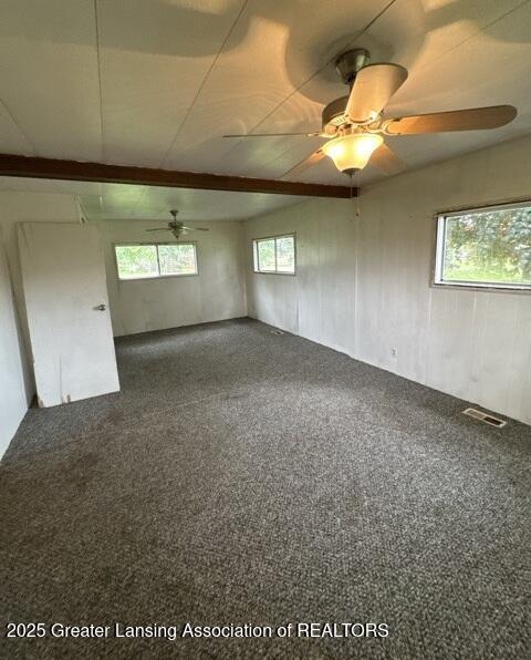 9882 W M 21, Ovid, MI 48866 - carpeted empty room featuring a ceiling fan