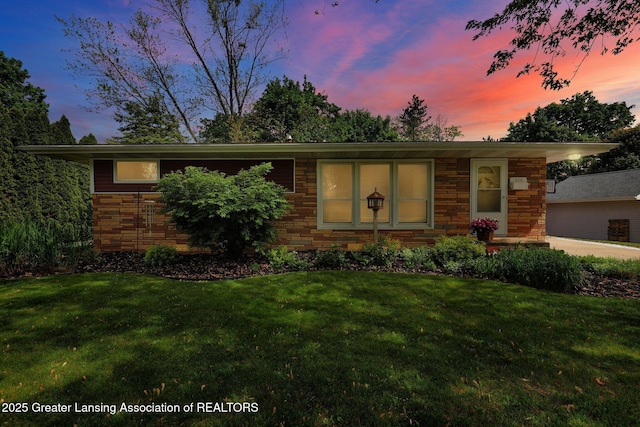 526 Detroit St, Portland, MI 48875 - ranch-style home featuring a yard and stone siding