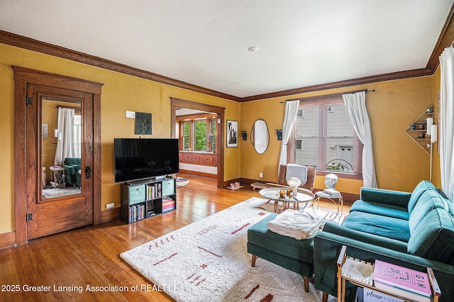 1417 W Ottawa St, Lansing, MI 48915 - living area with wood finished floors, ornamental molding, and baseboards