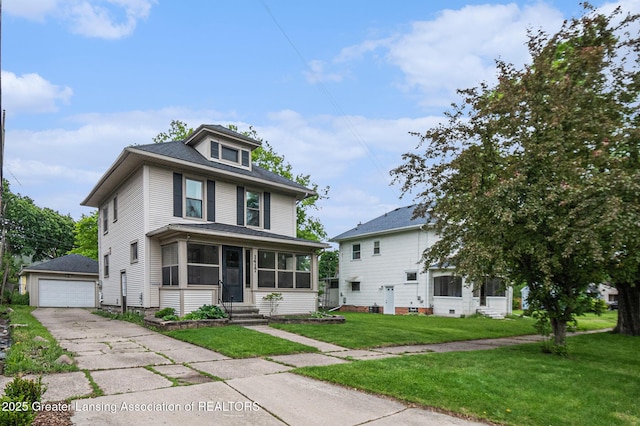 1417 W Ottawa St, Lansing, MI 48915 - american foursquare style home featuring an outbuilding, a sunroom, entry steps, a detached garage, and a front lawn