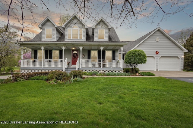 1990 S Waverly Rd, Eaton Rapids, MI 48827 - cape cod-style house featuring covered porch, concrete driveway, a front yard, an attached garage, and roof with shingles