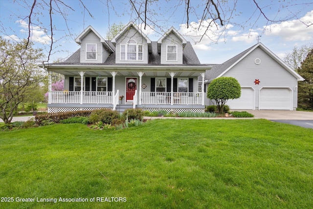 1990 S Waverly Rd, Eaton Rapids, MI 48827 - cape cod-style house with concrete driveway, covered porch, a front yard, and a garage