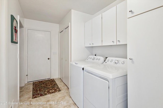 1990 S Waverly Rd, Eaton Rapids, MI 48827 - laundry area featuring cabinet space and washing machine and dryer