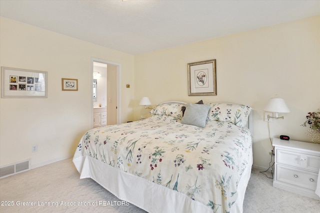 1990 S Waverly Rd, Eaton Rapids, MI 48827 - carpeted bedroom featuring connected bathroom