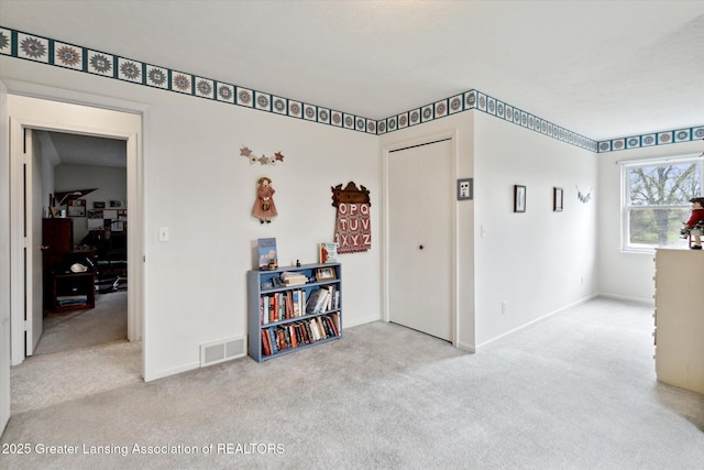 1990 S Waverly Rd, Eaton Rapids, MI 48827 - carpeted spare room featuring baseboards and an office area