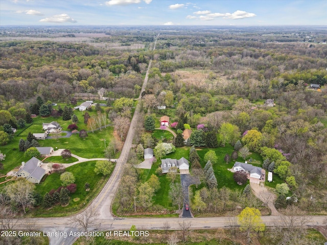 1990 S Waverly Rd, Eaton Rapids, MI 48827 - aerial overview of property's location featuring a heavily wooded area