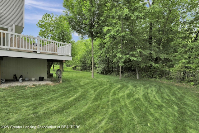 4269 Tamarack St, Holt, MI 48842 - view of green lawn featuring a deck