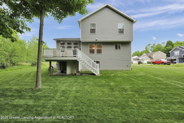 4269 Tamarack St, Holt, MI 48842 - back of property with a deck, stairs, and a yard