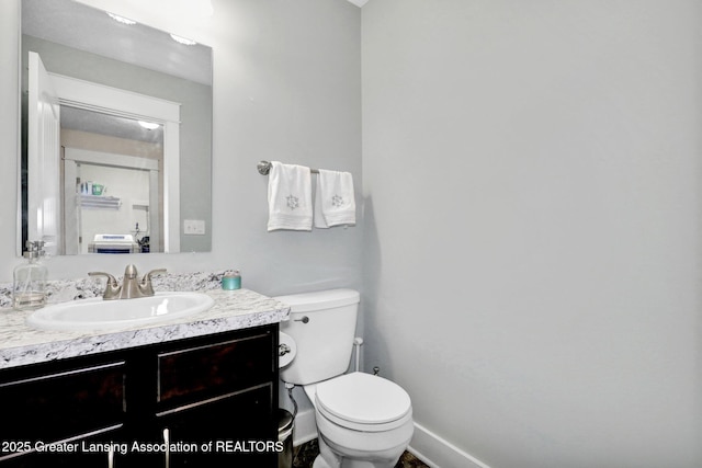 4269 Tamarack St, Holt, MI 48842 - half bath featuring vanity, toilet, and baseboards