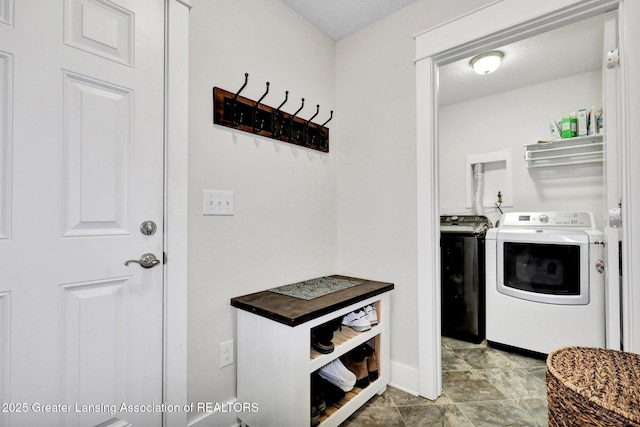 4269 Tamarack St, Holt, MI 48842 - washroom featuring baseboards and separate washer and dryer