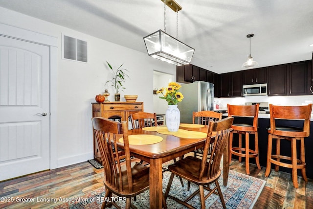 4269 Tamarack St, Holt, MI 48842 - dining space with light wood finished floors and baseboards