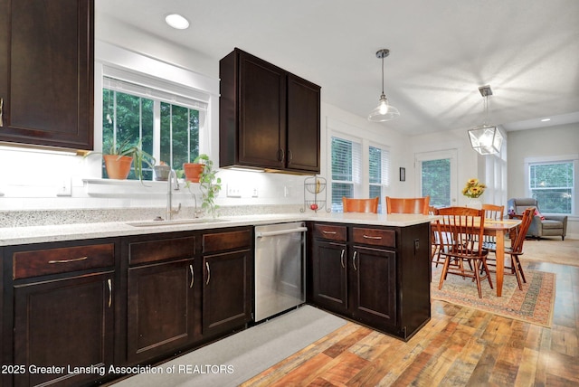 4269 Tamarack St, Holt, MI 48842 - kitchen featuring stainless steel dishwasher, a sink, light wood-style floors, a peninsula, and dark brown cabinetry