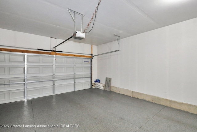4269 Tamarack St, Holt, MI 48842 - garage featuring a garage door opener