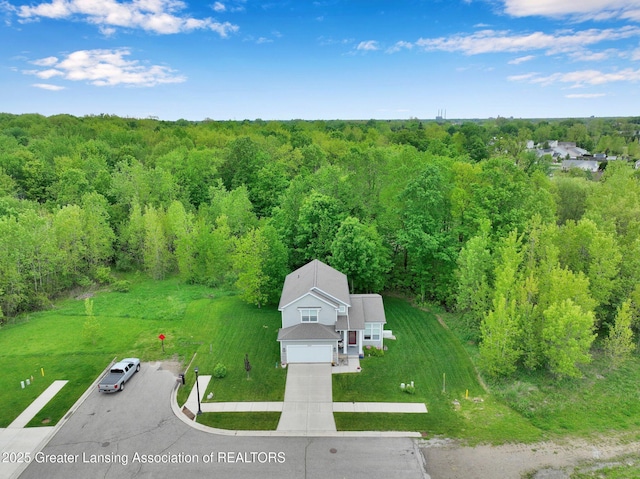 4269 Tamarack St, Holt, MI 48842 - view from above of property with a forest
