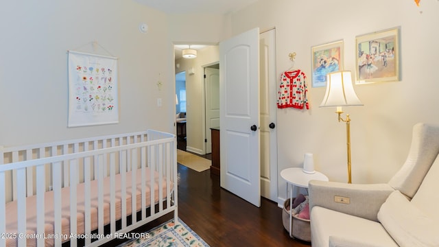 1451 Harvard Rd, East Lansing, MI 48823 - bedroom featuring wood finished floors and a crib