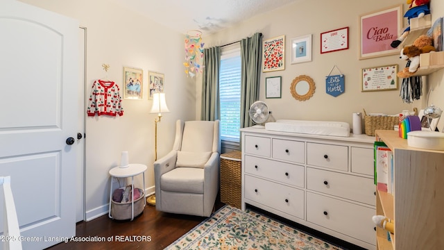 1451 Harvard Rd, East Lansing, MI 48823 - living area featuring dark wood finished floors and baseboards