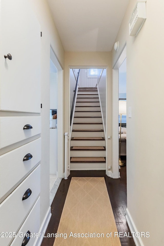 1451 Harvard Rd, East Lansing, MI 48823 - stairway with wood finished floors and baseboards