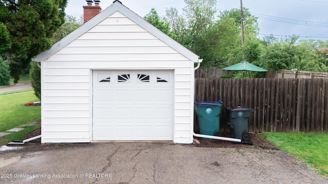 1451 Harvard Rd, East Lansing, MI 48823 - detached garage featuring asphalt driveway