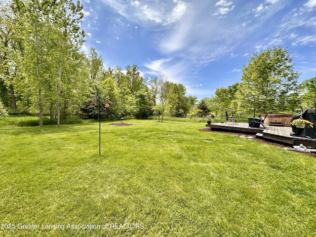 11195 W Herbison Rd, Eagle, MI 48822 - view of green lawn featuring a deck