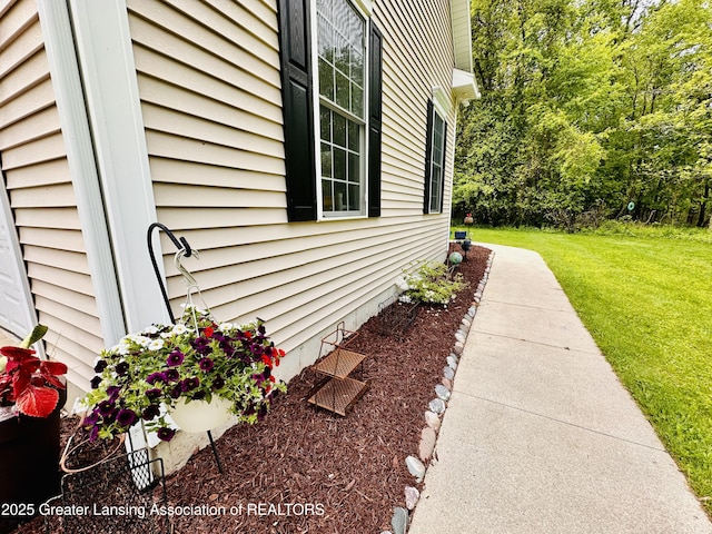 11195 W Herbison Rd, Eagle, MI 48822 - view of side of property with a yard