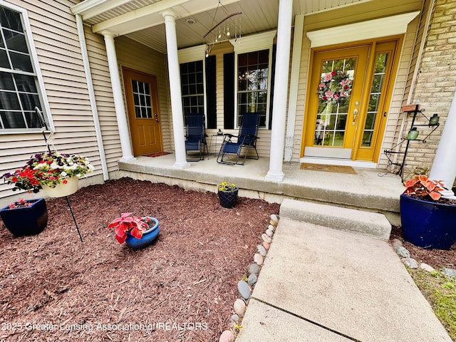 11195 W Herbison Rd, Eagle, MI 48822 - property entrance with a porch