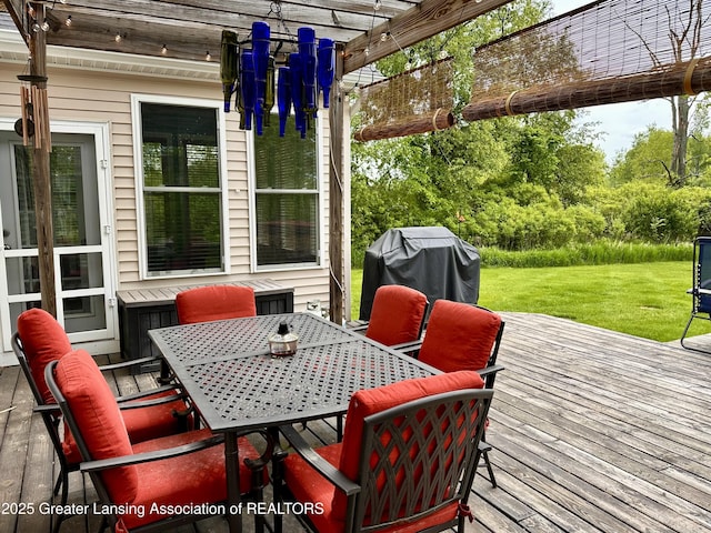 11195 W Herbison Rd, Eagle, MI 48822 - wooden deck featuring a pergola, a lawn, outdoor dining space, and area for grilling