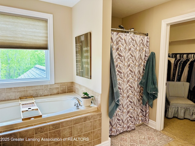 11195 W Herbison Rd, Eagle, MI 48822 - full bathroom featuring a garden tub and curtained shower