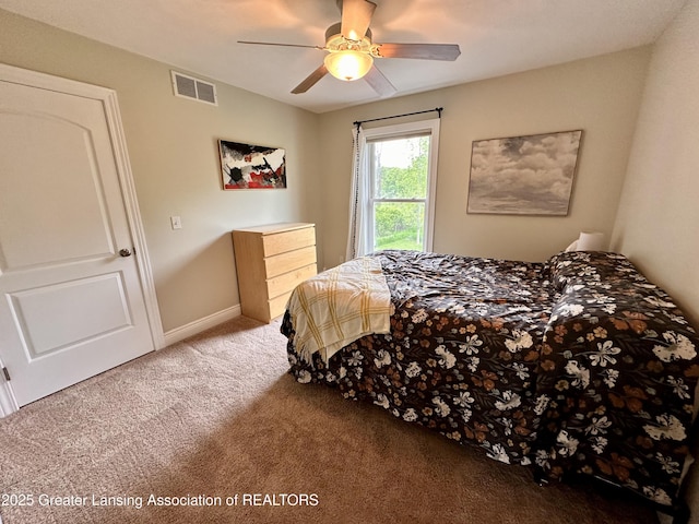11195 W Herbison Rd, Eagle, MI 48822 - carpeted bedroom featuring ceiling fan and baseboards