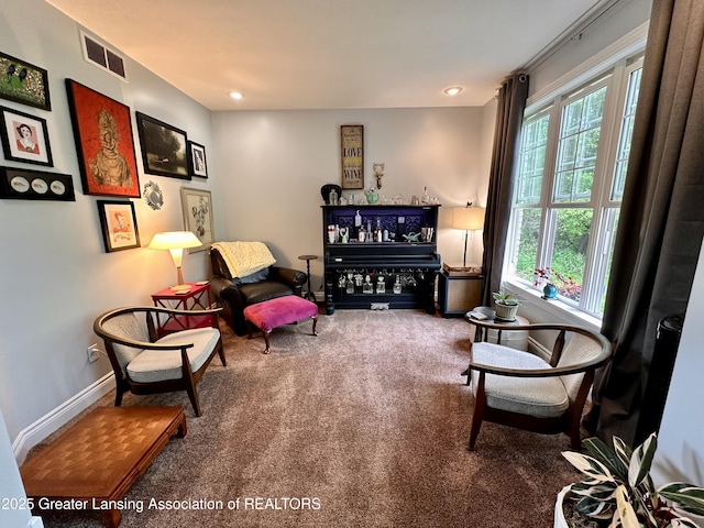 11195 W Herbison Rd, Eagle, MI 48822 - sitting room with plenty of natural light, carpet floors, baseboards, and recessed lighting