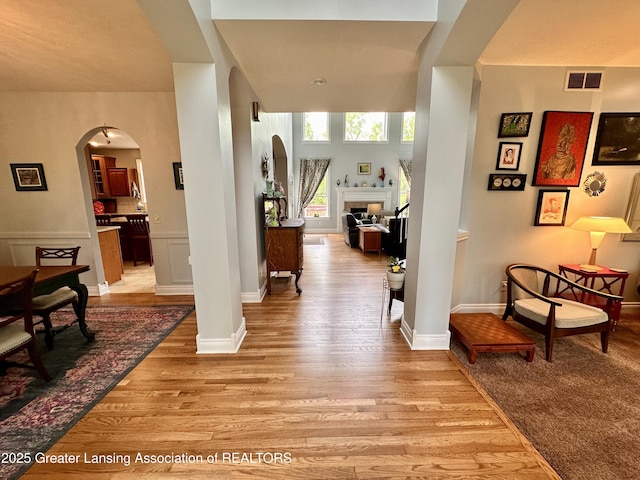 11195 W Herbison Rd, Eagle, MI 48822 - entrance foyer with arched walkways and light wood-style floors