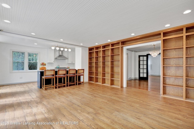 350 Kensington Rd, East Lansing, MI 48823 - living room featuring built in features, recessed lighting, light wood-style flooring, a chandelier, and baseboards