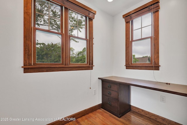 350 Kensington Rd, East Lansing, MI 48823 - unfurnished office with baseboards, light wood-style flooring, and built in study area