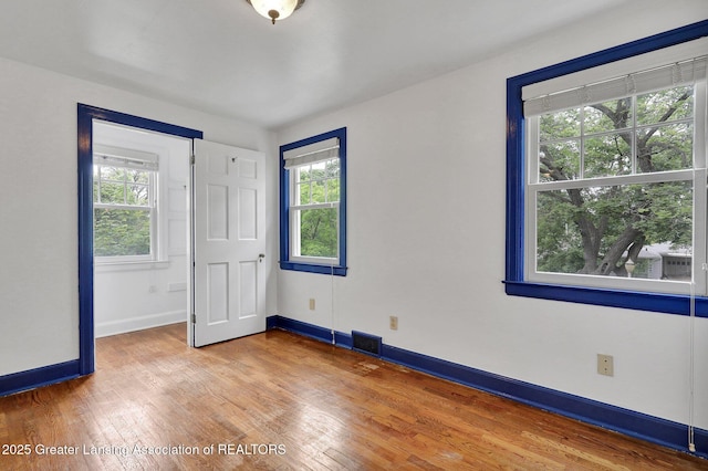 350 Kensington Rd, East Lansing, MI 48823 - empty room featuring wood finished floors and baseboards