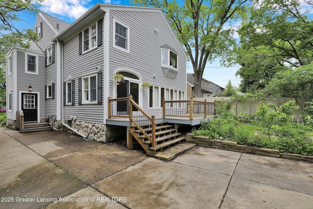 350 Kensington Rd, East Lansing, MI 48823 - view of front of property with a patio, a deck, and entry steps