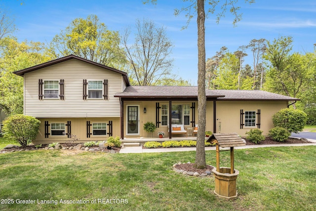 8450 Pineview Lake Dr, Linden, MI 48451 - tri-level home featuring covered porch and a front yard