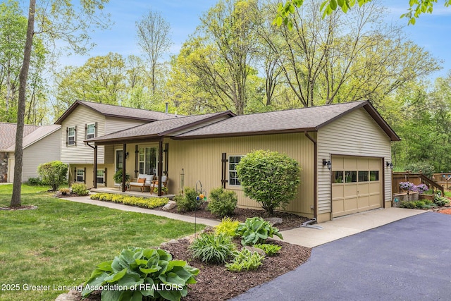 8450 Pineview Lake Dr, Linden, MI 48451 - view of front of house with a garage, asphalt driveway, and roof with shingles