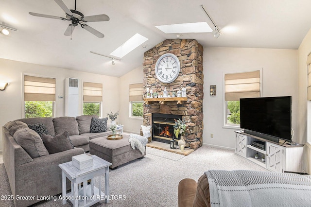 8450 Pineview Lake Dr, Linden, MI 48451 - living room featuring track lighting, a skylight, carpet flooring, plenty of natural light, and lofted ceiling